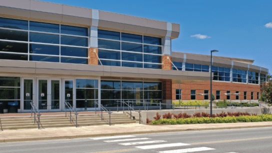 RiotLite on school building glass.