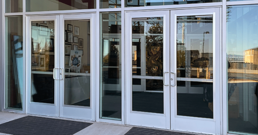 Glass doors of a storefront displaying security glass coating in the real world