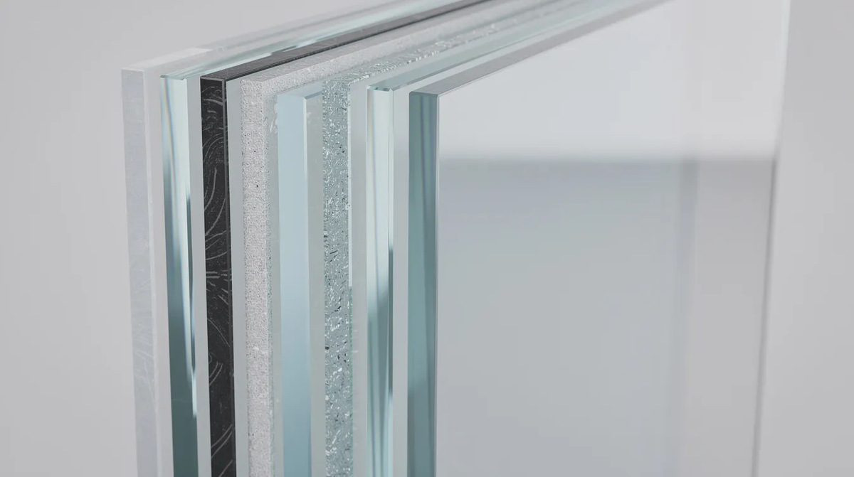 A close-up view of a multi-layered transparent security panel, showing the distinct layers of glass and polycarbonate designed for enhanced protection against threats such as forced entry and ballistic attacks.